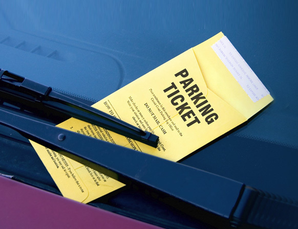 Parking ticket on car windshield