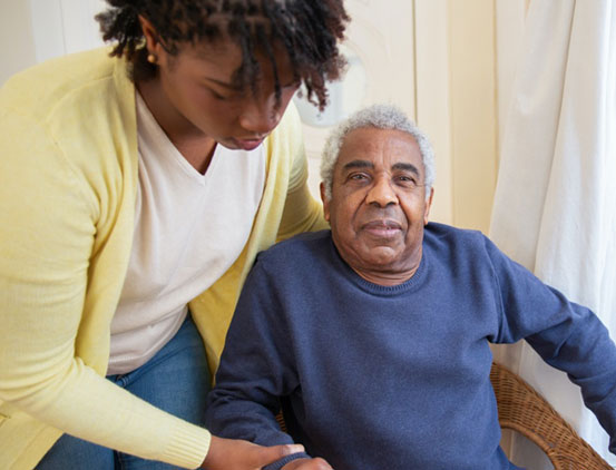 Woman helping senior man